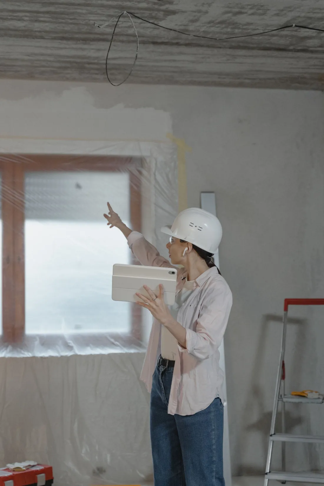 Two AS Home Solutions MD team members reviewing plans on site