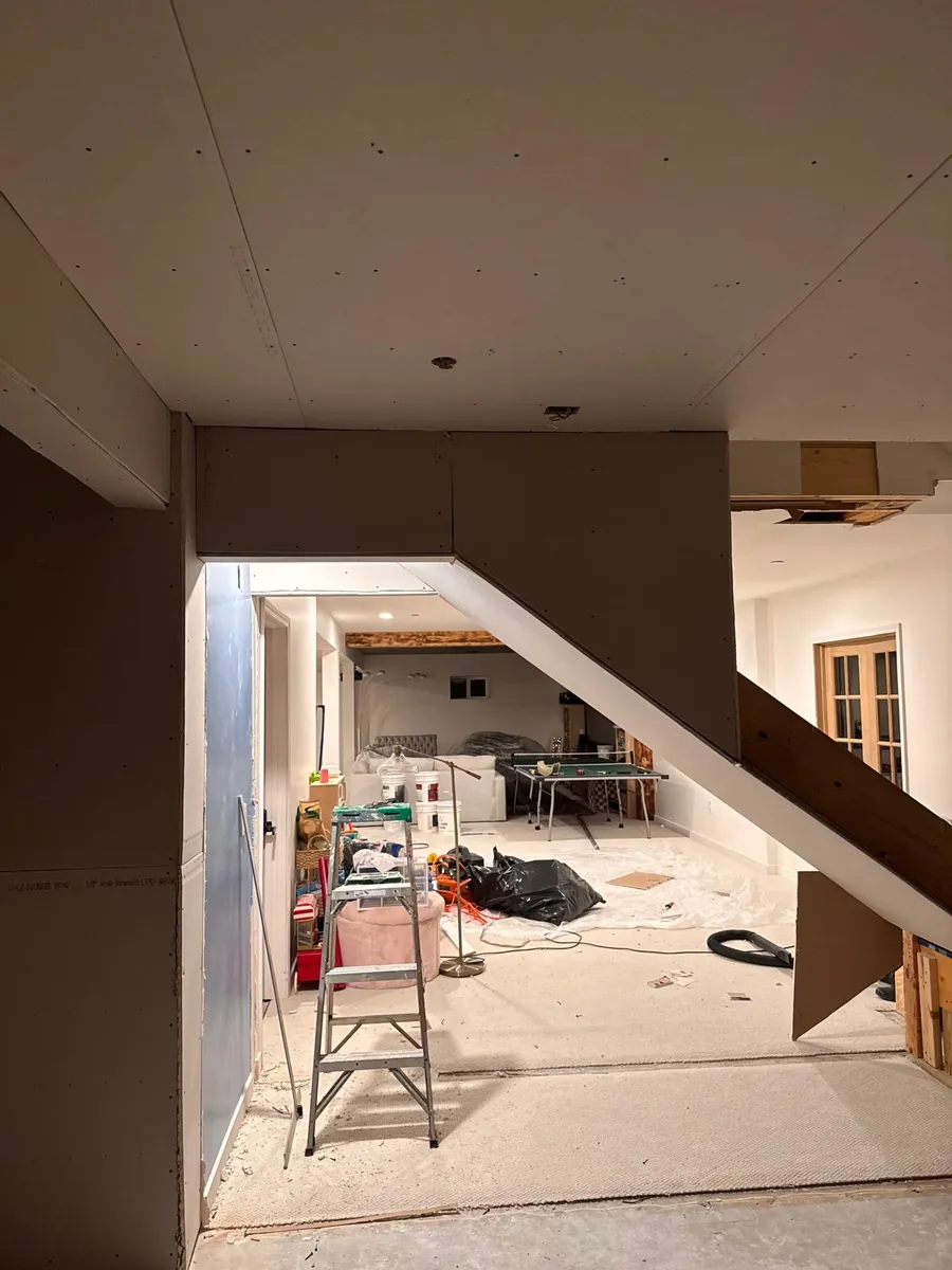 Board hung, stair soffit closed in — AS Home Solutions MD, Maryland